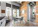 Contemporary dining area with wood accent wall, seating for four, and natural light at 302 Se Broadway St # 330, Ocala, FL 34471