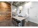 Contemporary kitchen featuring white cabinets, stainless steel appliances, and island seating at 302 Se Broadway St # 330, Ocala, FL 34471
