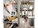 Open concept living room with unique décor, concrete floors, and natural light at 302 Se Broadway St # 330, Ocala, FL 34471