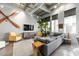 Bright, open living room featuring unique décor, comfortable seating, and large windows at 302 Se Broadway St # 330, Ocala, FL 34471