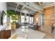 Bright, open living room with comfortable seating, concrete floors, and modern design elements at 302 Se Broadway St # 330, Ocala, FL 34471