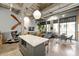 Open concept living space connecting kitchen and living areas in loft style at 302 Se Broadway St # 330, Ocala, FL 34471