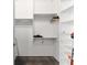 This walk-in closet is complete with custom shelving and storage racks at 302 Se Broadway St # 330, Ocala, FL 34471