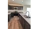 Modern kitchen with stainless steel appliances, granite countertops, and sleek cabinetry at 3474 Sw 155Th Pl, Ocala, FL 34473