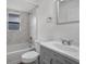 Clean bathroom with shower-tub combo, modern vanity, and marble-look tile at 4246 Ne 32Nd Cir, Ocala, FL 34479