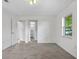 Bright, spacious bedroom featuring neutral carpet, white walls, and natural lighting at 4246 Ne 32Nd Cir, Ocala, FL 34479