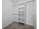 Walk-in closet with shelving and rods for ample storage space at 4246 Ne 32Nd Cir, Ocala, FL 34479