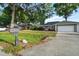 Charming single-story home with a manicured lawn and an attached two-car garage at 4246 Ne 32Nd Cir, Ocala, FL 34479