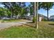 Charming front exterior of this home featuring a long driveway and mature landscaping at 4246 Ne 32Nd Cir, Ocala, FL 34479