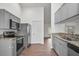 Modern kitchen featuring stainless steel appliances, granite countertops, and ample cabinet space at 4246 Ne 32Nd Cir, Ocala, FL 34479