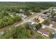 Bird's eye view displays a tranquil neighborhood with manicured lawns, mature trees, and well-maintained homes at 44 Pecan Run Dr, Ocala, FL 34472