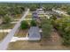 Aerial view of a well-maintained single-Gathering home with fenced-in backyard and mature landscaping at 44 Pecan Run Dr, Ocala, FL 34472