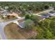 Scenic aerial view showcases home in quiet residential neighborhood with tree-lined streets and well-kept lawns at 44 Pecan Run Dr, Ocala, FL 34472