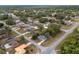 An aerial showcases the home's location in a peaceful neighborhood with tree-lined streets at 44 Pecan Run Dr, Ocala, FL 34472