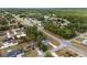 A high-angle view shows this home situated in a quiet neighborhood with mature tree coverage at 44 Pecan Run Dr, Ocala, FL 34472