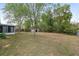 Large backyard area with mature trees, offering plenty of space and privacy at 44 Pecan Run Dr, Ocala, FL 34472