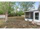 A spacious backyard featuring a screened patio extension, offering a blend of indoor and outdoor living at 44 Pecan Run Dr, Ocala, FL 34472