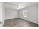 Clean and minimal bedroom design with grey walls and updated flooring at 44 Pecan Run Dr, Ocala, FL 34472