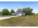 Single-story home featuring well-maintained landscaping, attached garage, and long driveway at 44 Pecan Run Dr, Ocala, FL 34472