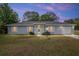 Charming single-story home with a well-manicured lawn and attached garage at 44 Pecan Run Dr, Ocala, FL 34472
