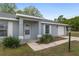 A charming single-Gathering home featuring an inviting front entrance and an attached garage at 44 Pecan Run Dr, Ocala, FL 34472