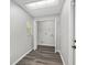 Laundry room with skylight, wood-look flooring, and utility hookups at 44 Pecan Run Dr, Ocala, FL 34472