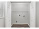 Bright laundry area equipped with hookups and a convenient storage shelf at 44 Pecan Run Dr, Ocala, FL 34472
