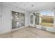 A screened-in patio equipped with windows and glass doors, enhancing indoor-outdoor living at 44 Pecan Run Dr, Ocala, FL 34472