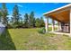Enjoy outdoor living on the home's covered patio and spacious backyard at 4780 Sw 103Rd Street Rd, Ocala, FL 34476