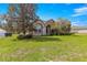 Charming home exterior with stone accents and landscaped front yard at 4780 Sw 103Rd Street Rd, Ocala, FL 34476