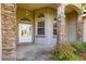 Inviting front entrance with decorative glass door, stone pillar accents, and covered porch at 4780 Sw 103Rd Street Rd, Ocala, FL 34476