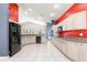 Spacious kitchen with updated cabinets, black appliances, tile floors and colorful accent walls at 4780 Sw 103Rd Street Rd, Ocala, FL 34476
