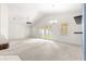 Open living room featuring a vaulted ceiling, neutral carpet, and sliding doors to the outdoors at 4780 Sw 103Rd Street Rd, Ocala, FL 34476
