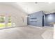 Open living room featuring neutral carpet, vaulted ceilings, and bright, colorful walls at 4780 Sw 103Rd Street Rd, Ocala, FL 34476