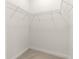 Walk-in closet offers wire shelving and neutral carpet at 4780 Sw 103Rd Street Rd, Ocala, FL 34476