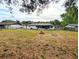 Large backyard featuring a fire pit area, ideal for entertaining and enjoying cool evenings at 4785 Ne 28Th Ter, Ocala, FL 34479
