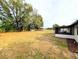 Expansive backyard with a lush green lawn, offering plenty of space for outdoor activities at 4785 Ne 28Th Ter, Ocala, FL 34479