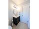 Bathroom with dark wood vanity and tiled floor at 4785 Ne 28Th Ter, Ocala, FL 34479