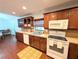 Updated kitchen featuring stainless steel appliances and dark wood cabinets with tile backsplash at 4785 Ne 28Th Ter, Ocala, FL 34479