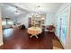Spacious living room featuring hardwood floors, natural light, and a cozy seating area at 4785 Ne 28Th Ter, Ocala, FL 34479