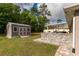 Backyard showing a shed and outdoor kitchen and bar area on paver patio at 5026 Sw 128Th St, Ocala, FL 34473