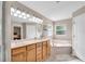 Bathroom featuring double sinks, a soaking tub, natural lighting, and vanity at 5026 Sw 128Th St, Ocala, FL 34473