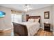Bedroom featuring natural light, hardwood floors, and wicker furniture at 5026 Sw 128Th St, Ocala, FL 34473