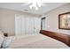 Bedroom featuring hardwood floors, natural lighting, and closet space at 5026 Sw 128Th St, Ocala, FL 34473