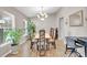 Cozy dining area featuring hardwood floors, natural light, and comfortable seating ideal for everyday meals at 5026 Sw 128Th St, Ocala, FL 34473