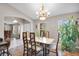 Cozy dining area featuring hardwood floors, natural light, and comfortable seating ideal for everyday meals at 5026 Sw 128Th St, Ocala, FL 34473