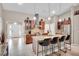 Open kitchen featuring granite countertops, stainless steel appliances, and a breakfast bar with seating at 5026 Sw 128Th St, Ocala, FL 34473