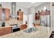 Spacious kitchen with stainless steel appliances, granite countertops, and ample cabinet space at 5026 Sw 128Th St, Ocala, FL 34473