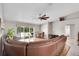 Open-concept living room featuring hardwood floors, recessed lighting, and access to the patio at 5026 Sw 128Th St, Ocala, FL 34473