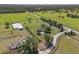 Expansive horse property featuring a well-maintained home, riding arena and picturesque green pastures at 5363 Nw 153Rd Ct, Morriston, FL 32668